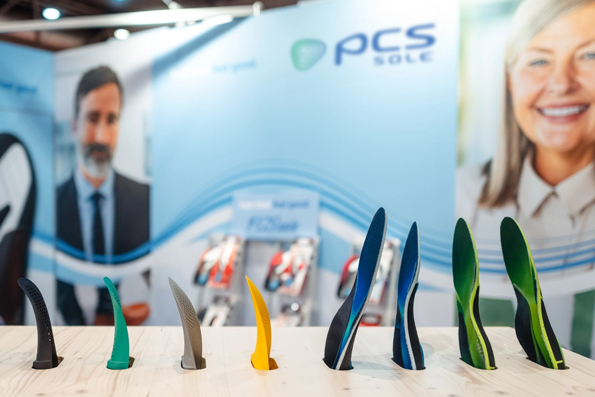 Close-up of the PCS Sole exhibition stand at OTWorld in Leipzig, focusing on stand design and brand staging. Design and implementation by the R211 agency.